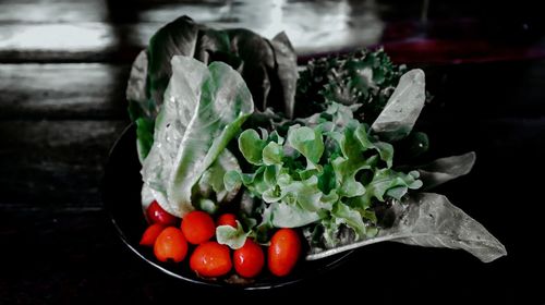 Close-up of fruits in container on table