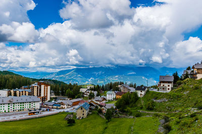 A landscape view of the french alps mountains and the ski resort buildings on a summer day