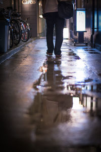 Blurred motion of people walking on sidewalk