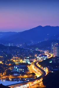 High angle view of illuminated city at night