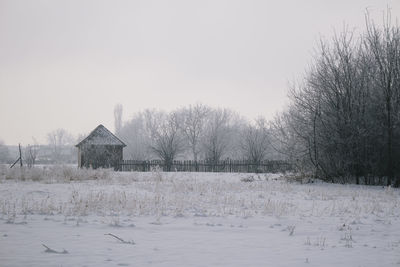 Scenic view of snow covered trees against clear sky