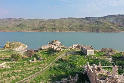 Scenic view of landscape and lake against sky