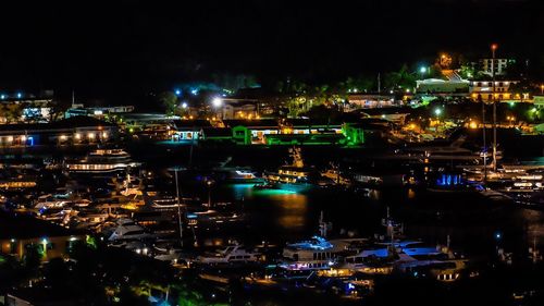 Boats in harbor at night