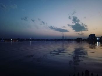 Scenic view of lake against sky at sunset