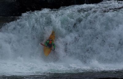 Man canoeing in water