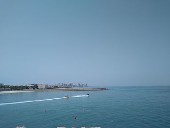 Scenic view of sea against clear blue sky