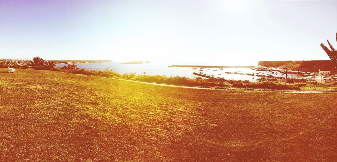 clear sky, beach, sea, water, copy space, horizon over water, tranquil scene, tranquility, sand, scenics, shore, beauty in nature, nature, sunlight, sky, idyllic, outdoors, no people, remote, day