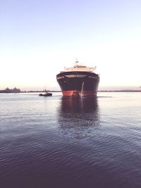 Ship in sea against clear sky