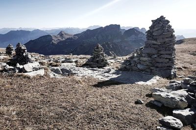 Rock formations on landscape against sky