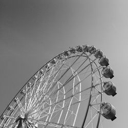 Low angle view of ferris wheel against sky