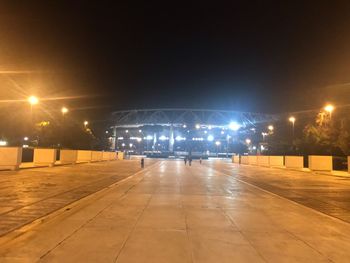 Illuminated street lights on footpath at night