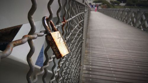 Close-up of padlocks on railing