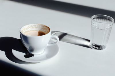 Close-up of coffee cup on table