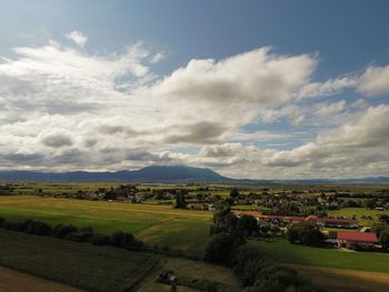 Scenic view of agricultural field against sky