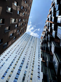 Low angle view of modern buildings against sky