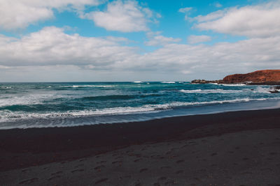 Scenic view of beach against sky