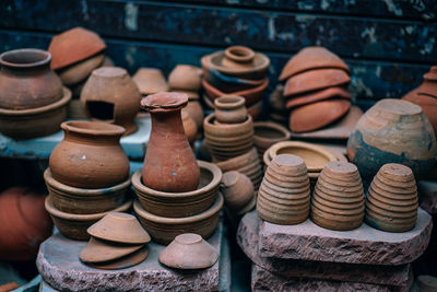 Stack of earthenware for sale in market