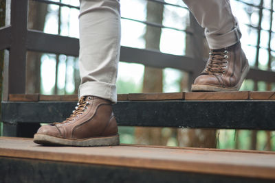 Low section of people standing on railing