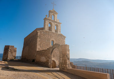 Low angle view of moya's church against clear sky