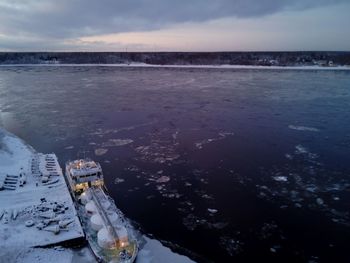 Scenic view of sea against sky during winter