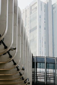 Modern buildings in city against clear sky