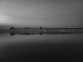 Pier over sea against sky