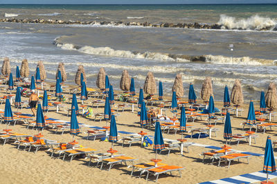 High angle view of chairs on beach