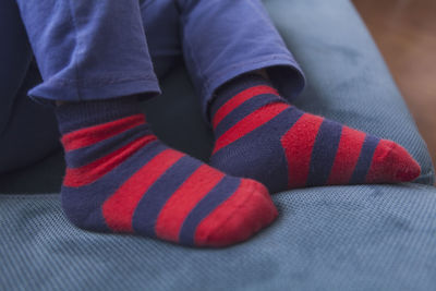 Low section of man wearing shoes