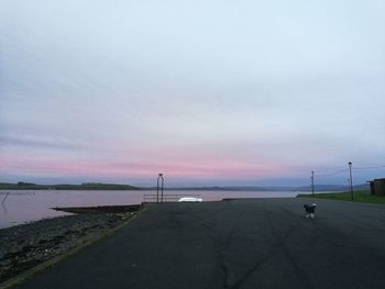 Scenic view of beach against sky during sunset