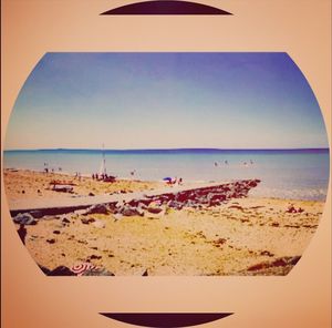 Scenic view of beach against clear sky