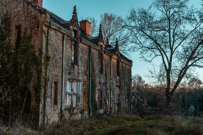 Low angle view of old building against sky