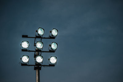 Close-up of lamp post against the sky