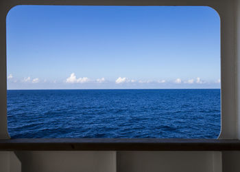 Close-up of sea against clear blue sky