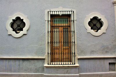 Low angle view of window on wall of building