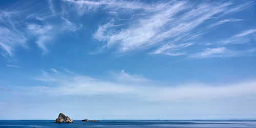 Scenic view of sea against blue sky