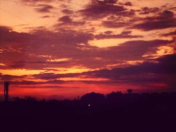 Scenic view of landscape against sky at sunset