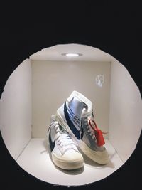 High angle view of shoes on table against black background