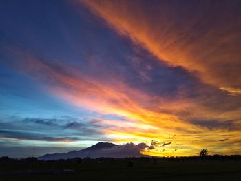 Scenic view of dramatic sky during sunset