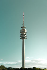 Low angle view of communications tower against sky