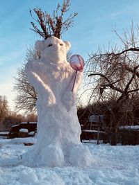 Wonderful snowman, garden in winter, snowman in the yard, winter