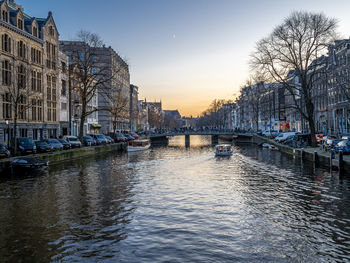 Canal amidst buildings in city
