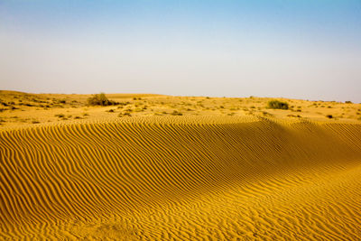 Scenic view of desert against clear sky