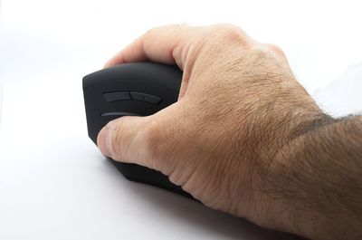 Close-up of human hand against white background