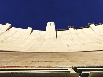 Low angle view of built structure against clear blue sky