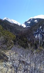 Scenic view of snowcapped mountains against clear sky