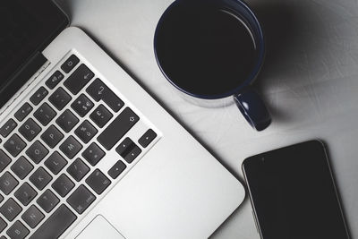 High angle view of coffee cup on table