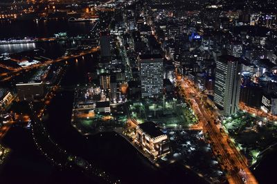 High angle view of illuminated city buildings at night