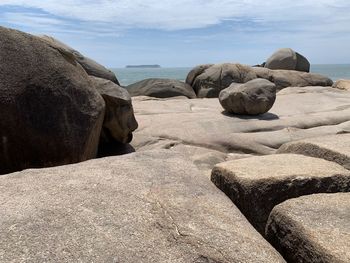 Rocks on beach against sky in florianapolis 