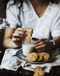 Midsection of woman having breakfast