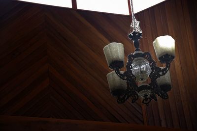 Low angle view of illuminated lamp at home